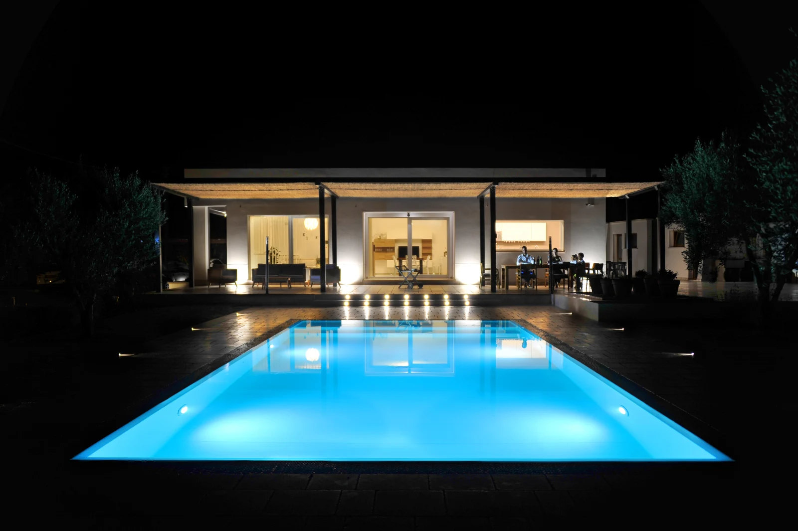 Villa pool illuminated at night
