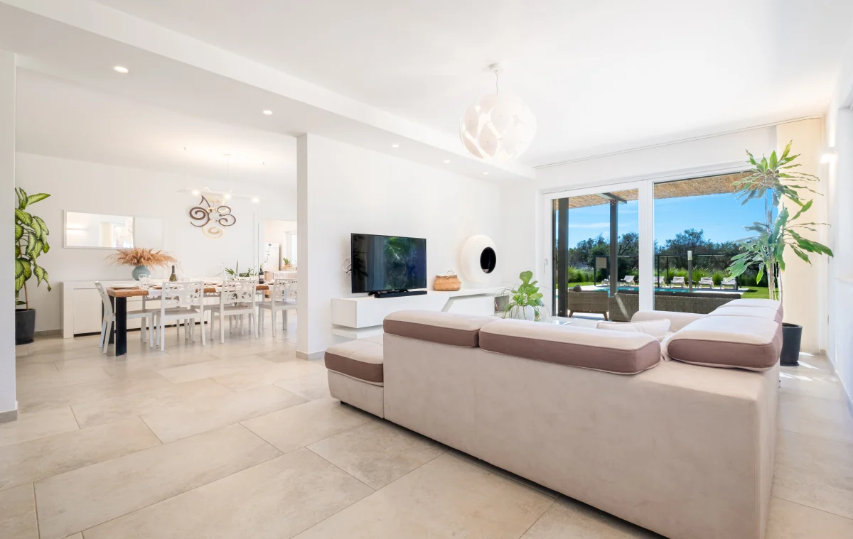 Living and dining areas opening toward the garden